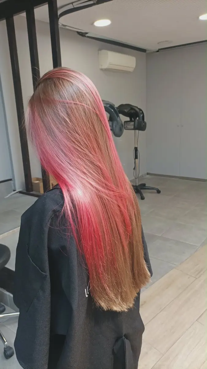 Straight hair with pink colour on the lengths and ends